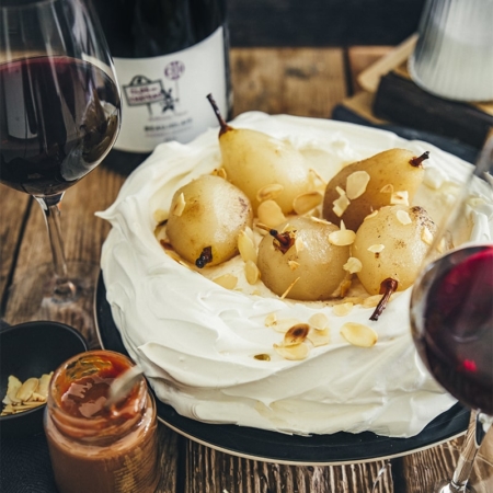 Pavlova with poached pears and caramel